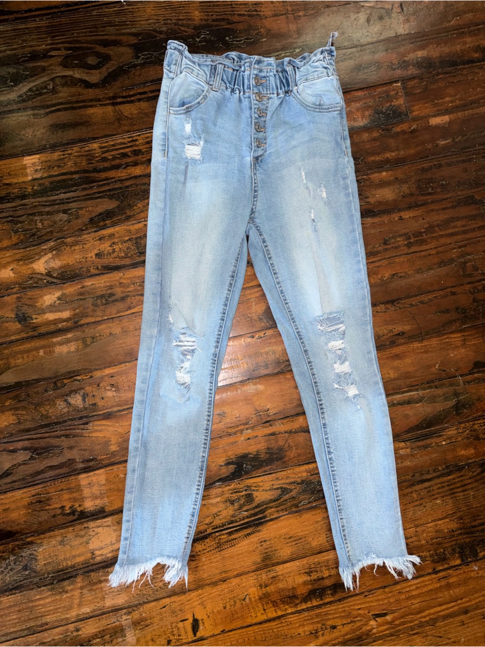 High-Rise Light Blue Skinny Jeans with Distressed Hem